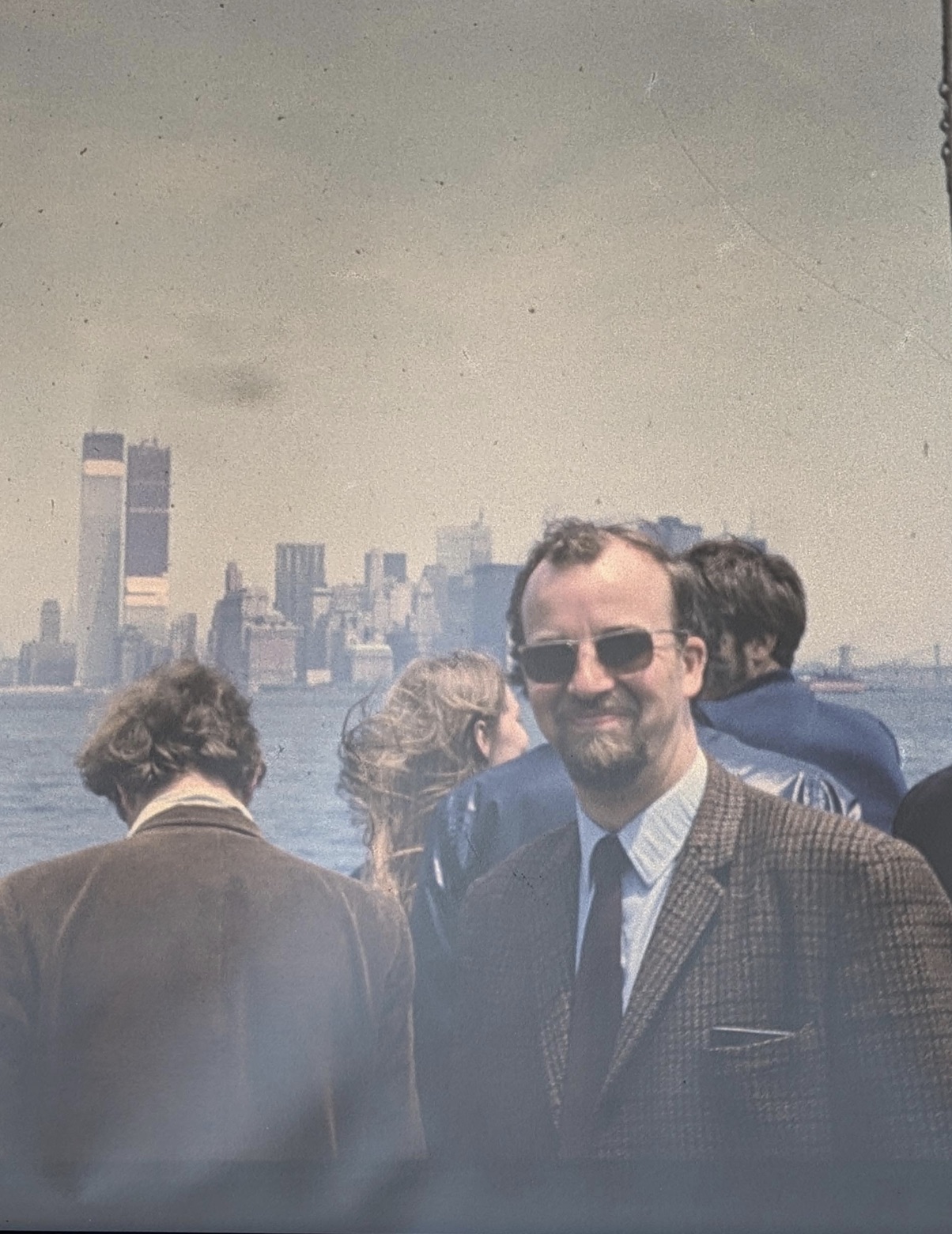 My grandfather in front of the Twin Towers under construction around 1970. 